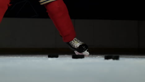 Close-up-hockey-player-strikes-the-goal-in-slow-motion